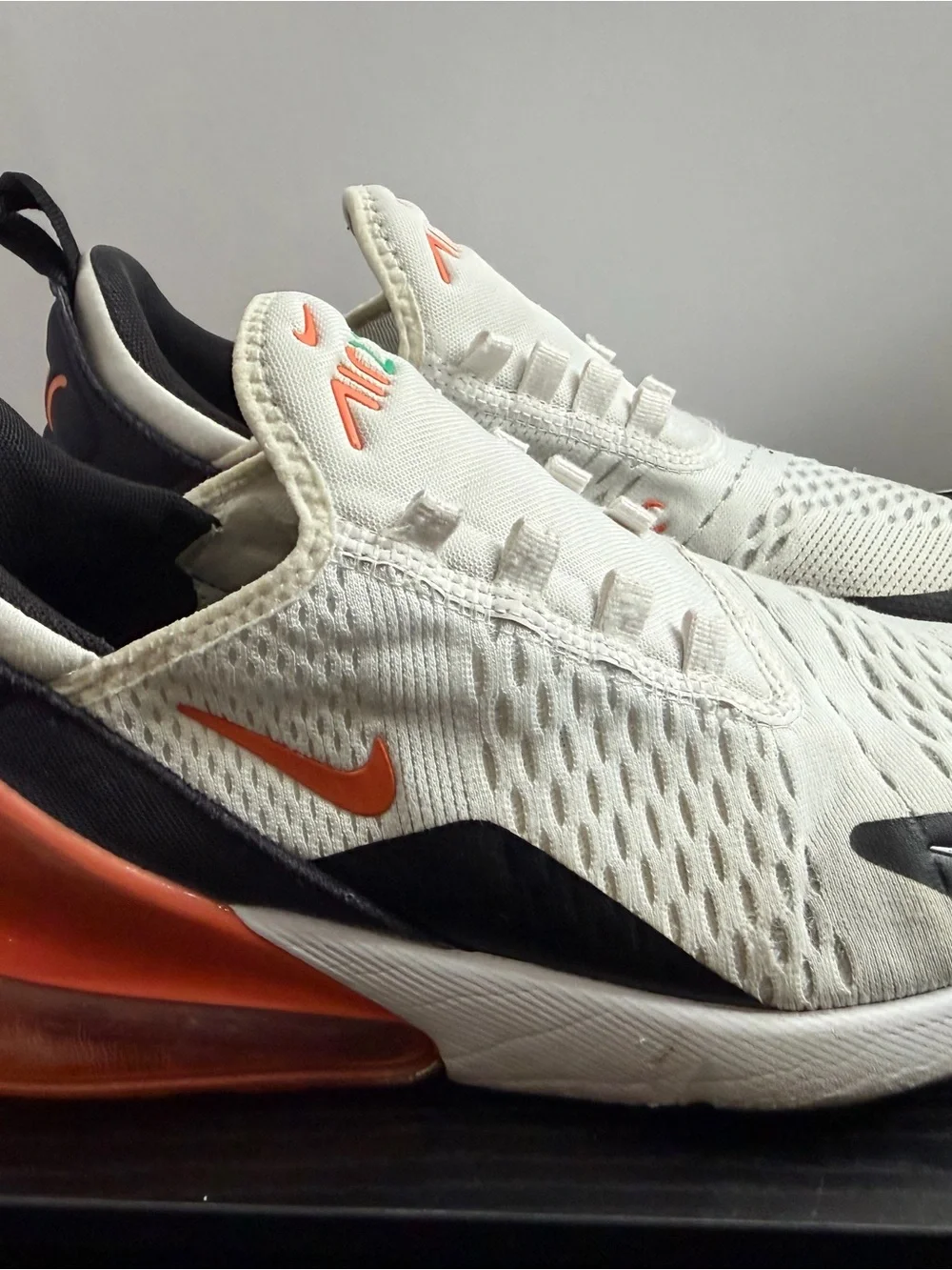 Nike Kids White Sneakers with Black, Orange and Green Accents